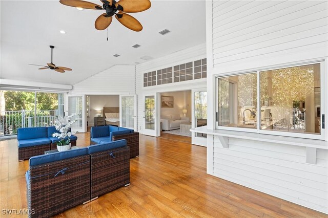 4090 W Gulf Dr, Sanibel, FL 33957 - living area featuring visible vents, wood finished floors, a high ceiling, and ceiling fan