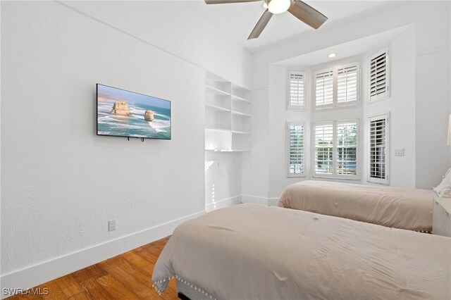 4090 W Gulf Dr, Sanibel, FL 33957 - bedroom featuring ceiling fan, baseboards, and wood finished floors