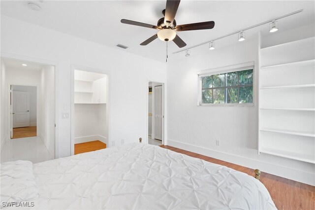 4090 W Gulf Dr, Sanibel, FL 33957 - bedroom featuring visible vents, ceiling fan, baseboards, and wood finished floors