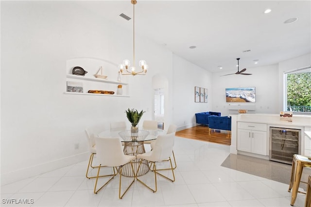 4090 W Gulf Dr, Sanibel, FL 33957 - dining space featuring recessed lighting, baseboards, beverage cooler, and ceiling fan with notable chandelier