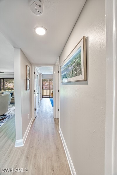 hall with light hardwood / wood-style flooring