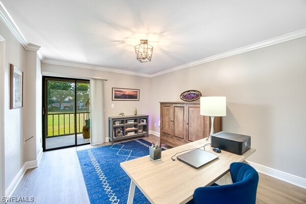 office area with wood-type flooring, a notable chandelier, and crown molding