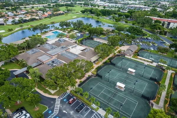 birds eye view of property with a water view