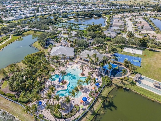 birds eye view of property with a water view