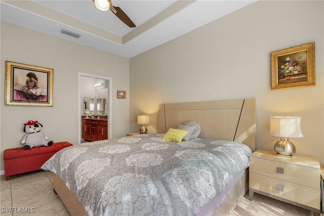 bedroom featuring ceiling fan, connected bathroom, and light tile patterned floors