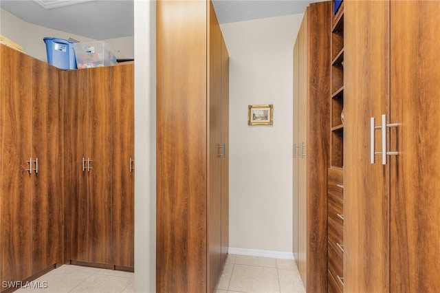 corridor featuring light tile patterned flooring