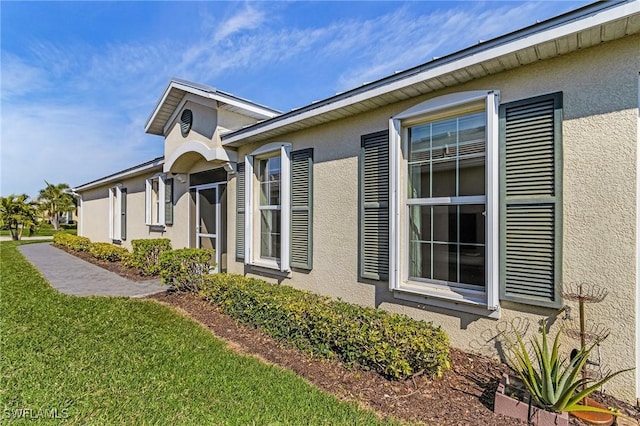 view of home's exterior with a lawn