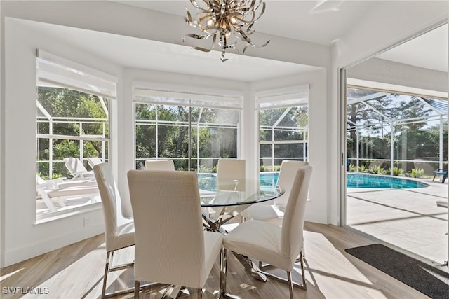 sunroom with an inviting chandelier