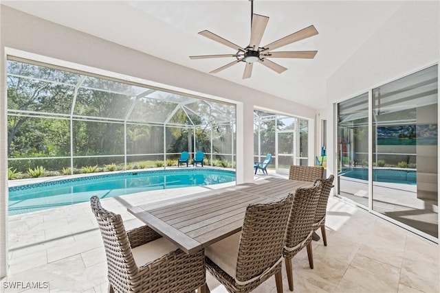 view of pool with a patio, a lanai, and ceiling fan