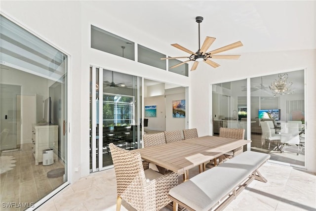 sunroom / solarium featuring vaulted ceiling and ceiling fan