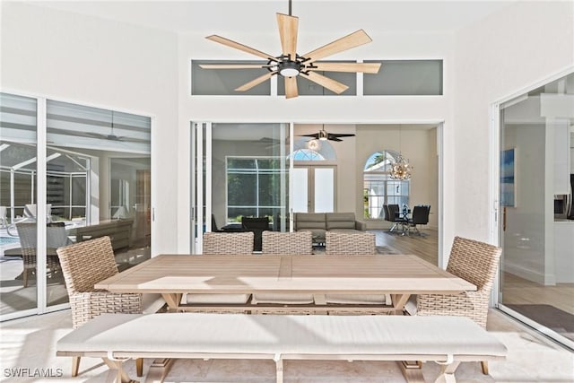 dining space featuring french doors, ceiling fan, and light wood-type flooring