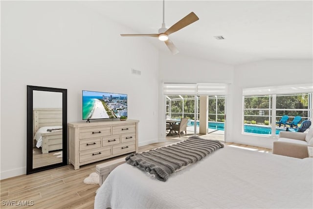 bedroom featuring lofted ceiling, access to exterior, ceiling fan, and light hardwood / wood-style flooring