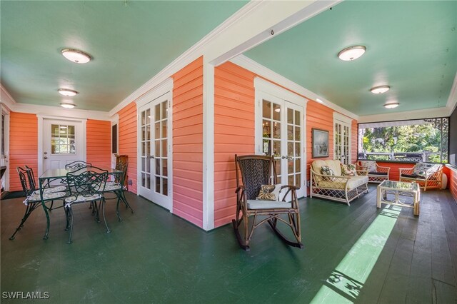 sunroom featuring french doors