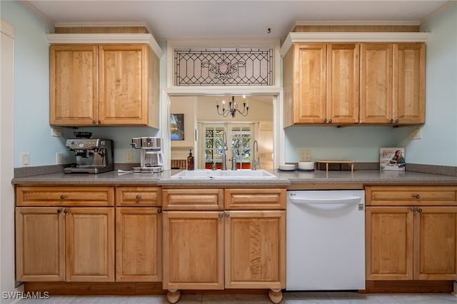 kitchen featuring crown molding, dishwasher, and sink