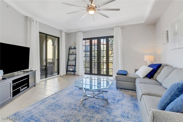 living room featuring french doors, ceiling fan, and light tile patterned flooring