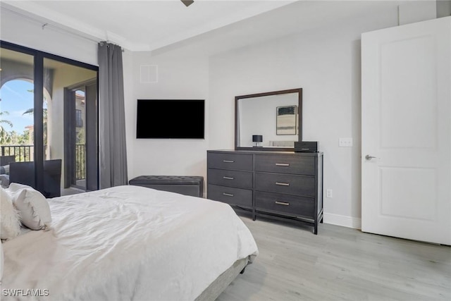 bedroom featuring access to exterior and light hardwood / wood-style floors