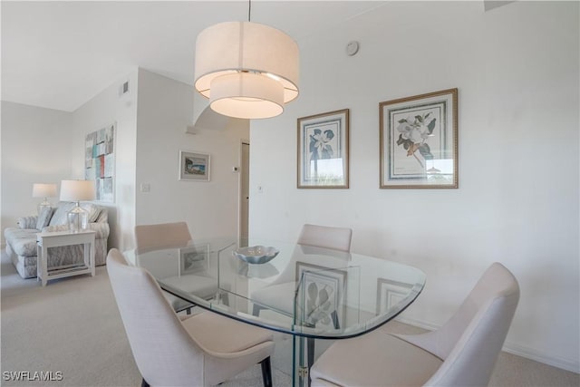 dining room with light carpet