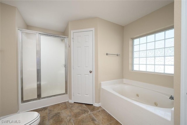 bathroom with a shower stall, baseboards, toilet, and a tub with jets