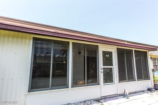 back of house with a sunroom