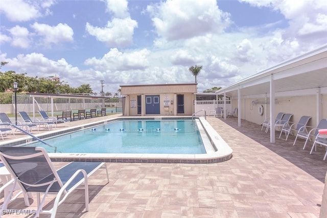 view of swimming pool featuring a patio area