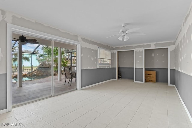 unfurnished room featuring ceiling fan