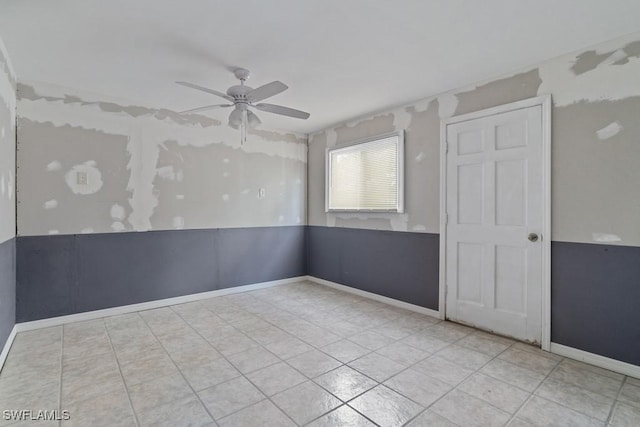 unfurnished room featuring ceiling fan