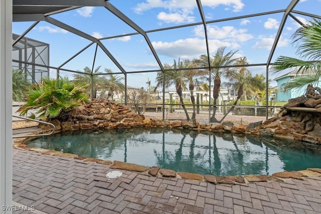 view of pool with a lanai