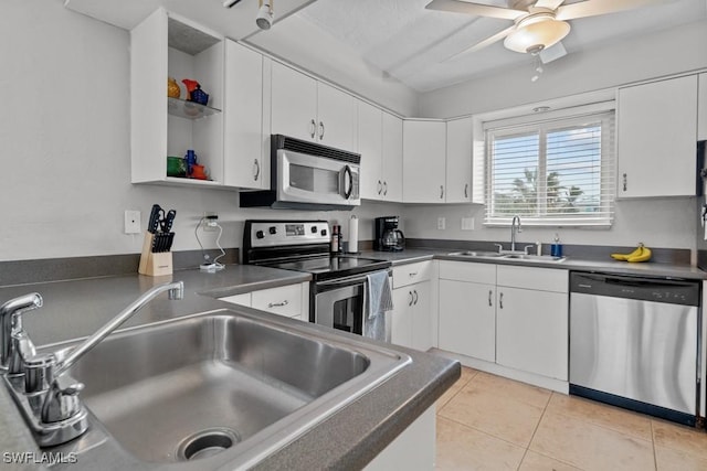 kitchen featuring stainless steel appliances, sink, and white cabinets