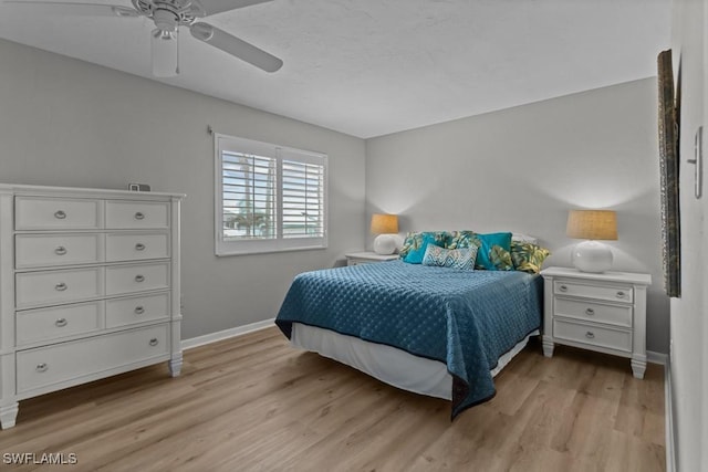 bedroom featuring ceiling fan and light hardwood / wood-style floors