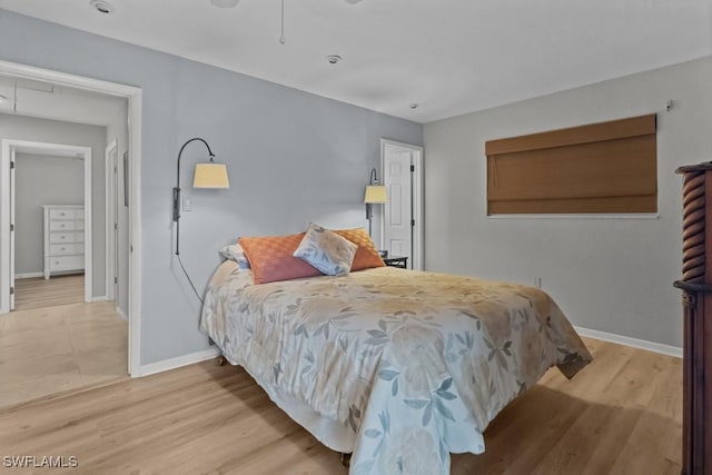 bedroom with hardwood / wood-style flooring