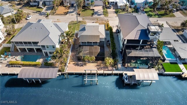 bird's eye view with a water view