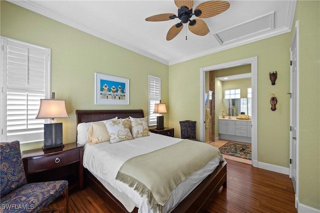 bedroom featuring dark wood-type flooring, ornamental molding, ceiling fan, and ensuite bathroom