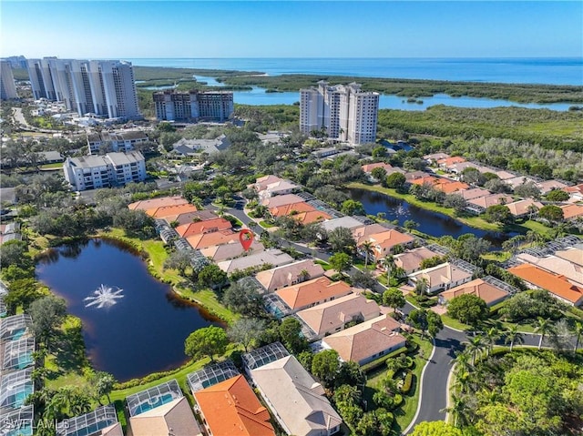 bird's eye view featuring a view of city and a water view