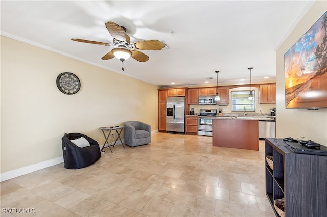 kitchen with crown molding, stainless steel appliances, open floor plan, a sink, and baseboards