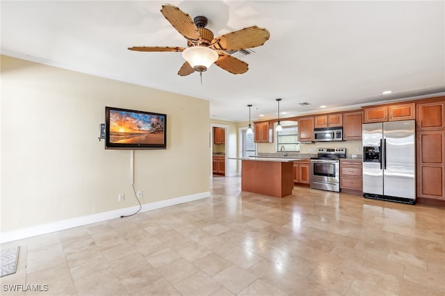 kitchen featuring a sink, baseboards, hanging light fixtures, appliances with stainless steel finishes, and brown cabinetry