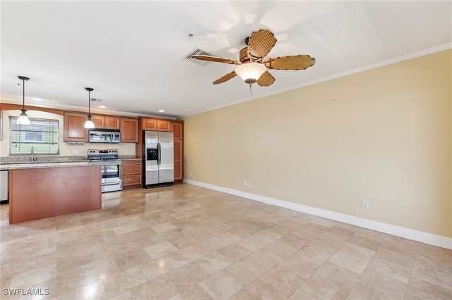 kitchen featuring appliances with stainless steel finishes, a sink, crown molding, and baseboards