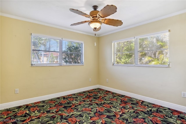 spare room featuring ornamental molding and baseboards