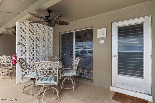 view of patio / terrace featuring outdoor dining area and a ceiling fan