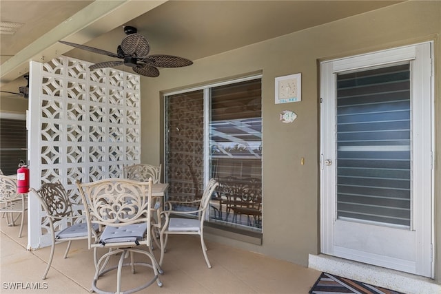 view of patio / terrace featuring ceiling fan and visible vents