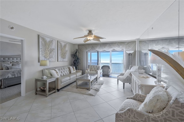 tiled living room with ceiling fan