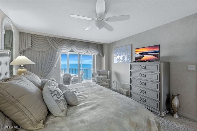 bedroom with access to exterior, carpet floors, and ceiling fan