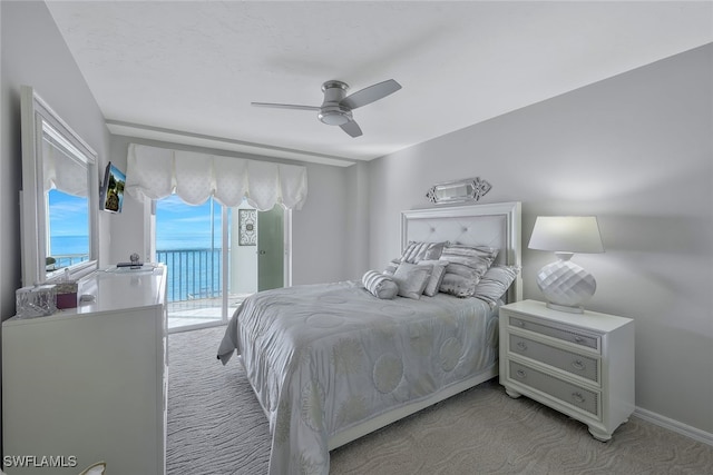 carpeted bedroom featuring access to outside and ceiling fan