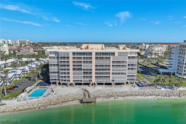 bird's eye view featuring a view of the beach and a water view