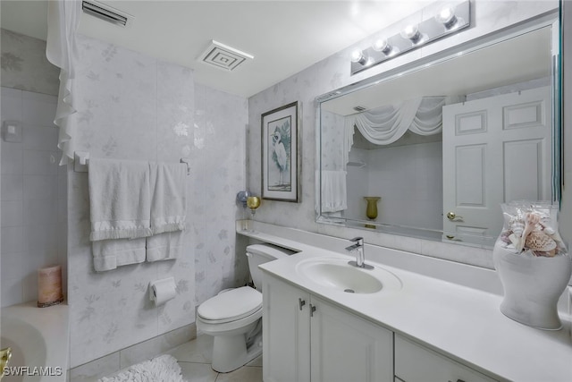 1020 S Collier Blvd Unit 203, Marco Island, FL 34145 - bathroom with tile patterned floors, vanity, toilet, and visible vents