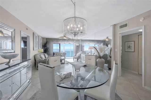 1020 S Collier Blvd Unit 203, Marco Island, FL 34145 - dining space featuring an inviting chandelier, baseboards, light tile patterned flooring, and visible vents
