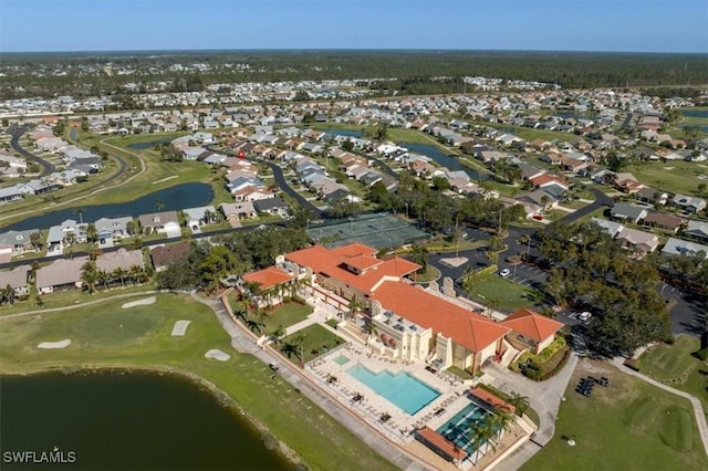 aerial view with a residential view and a water view