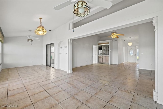 unfurnished living room featuring lofted ceiling, ceiling fan, and light tile patterned flooring