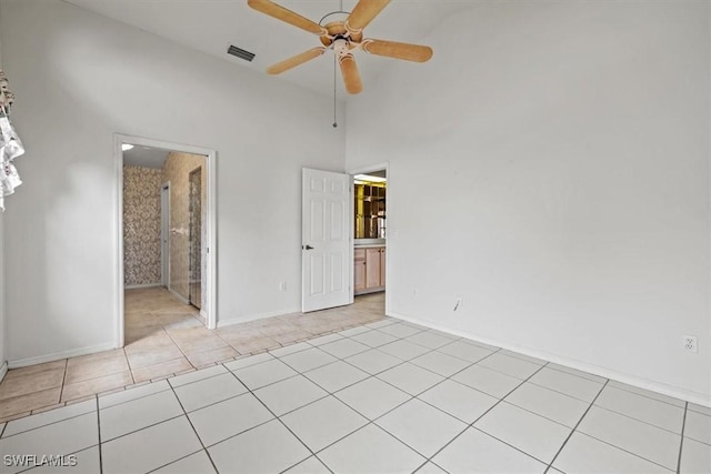 empty room with light tile patterned flooring and ceiling fan