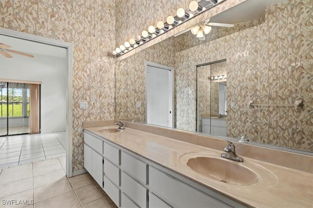 bathroom with ceiling fan, tile patterned floors, and vanity