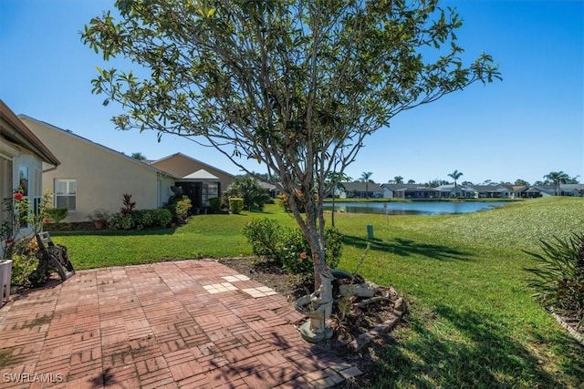 view of patio with a water view